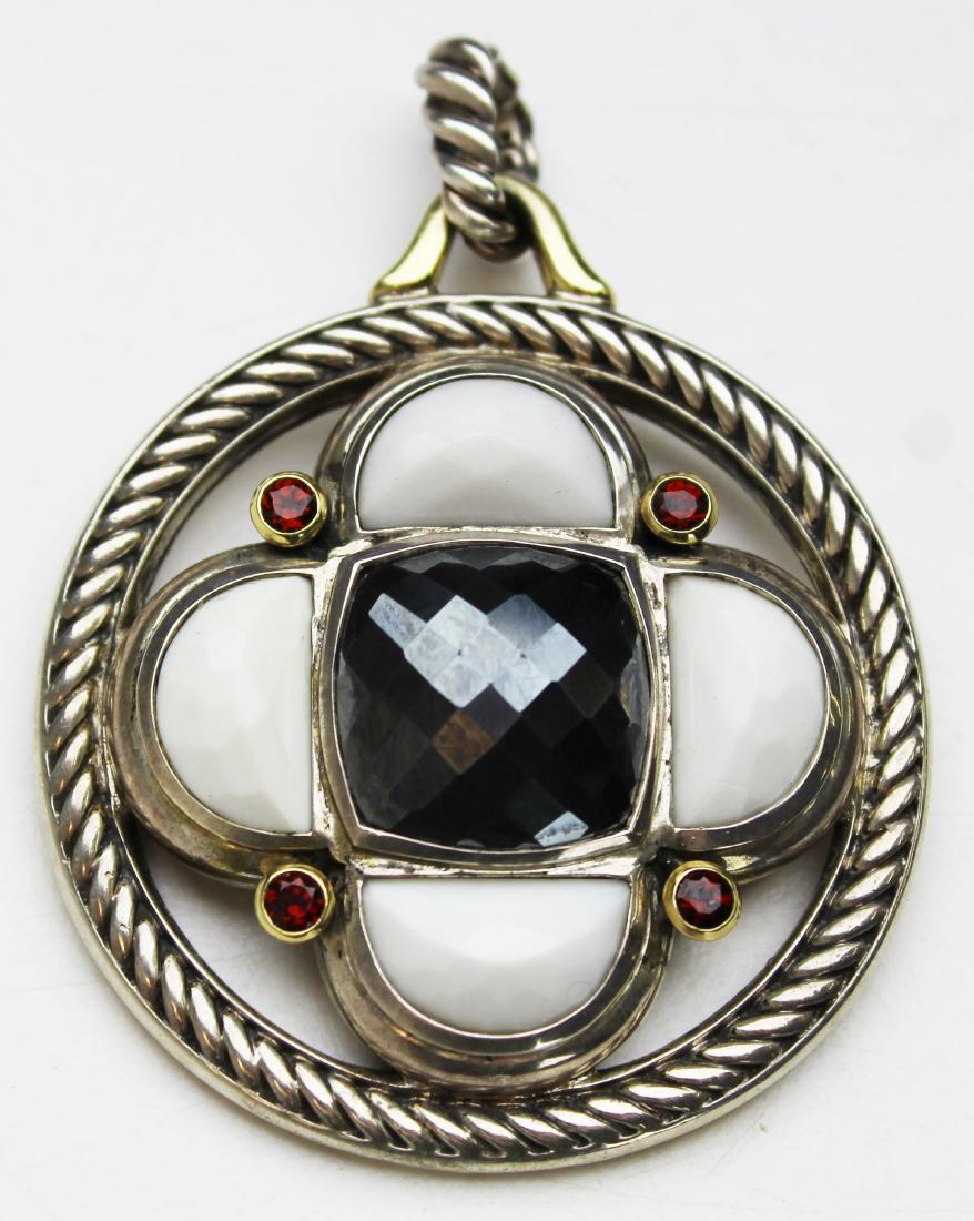 David Yurman pendant: Signed David Yurman sterling, 18k yellow gold, Quartz, garnet, and black topaz. Center black topaz 16 mm x 16 mm surrounded by four small round cut garnets and 4 white quartz panels. Sterling and 18k