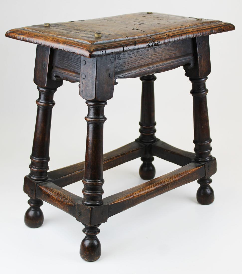 reproduction English oak and burl joiner's stool: fine bench made reproduction 17th c. English oak joiner's stool with turned legs, stretcher base and burl elm molded top, pegged construction 19" x 18" x 11"