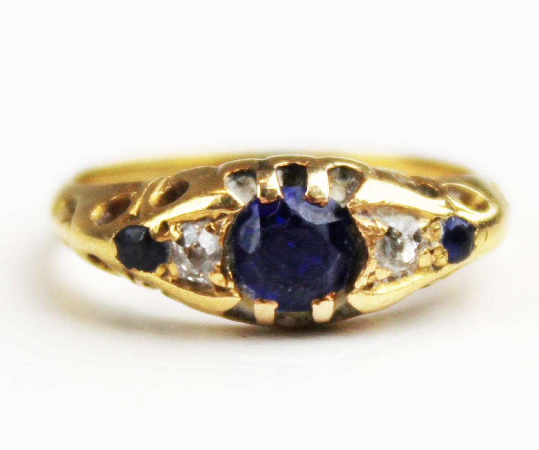 Ca 1900 Sapphire & diamond ladies ring: Ca. 1900 yellow gold ring set with .25 ct round cut sapphire with 2 .01 ct diamonds and 2 .01 ct sapphires. Ring size 4.5