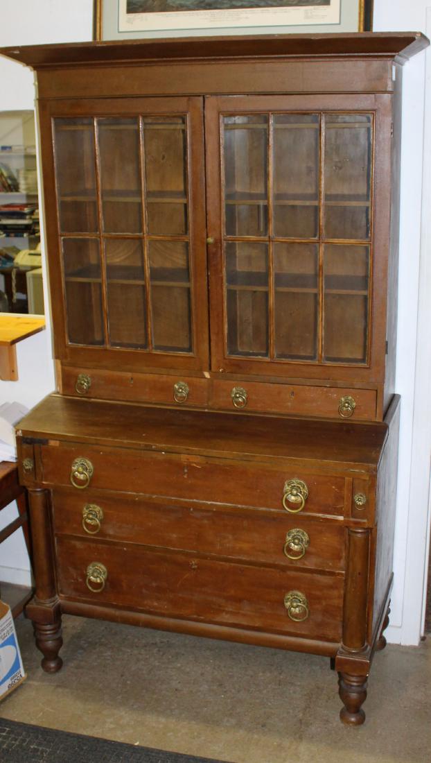 19th c. Empire 2 part bookcase secretary desk: 19th c. Empire style 2 part secretary with column front 4 drawer lower desk portion and glass double door bookcase upper section surmounted by wide molding, in later old painted surface with original