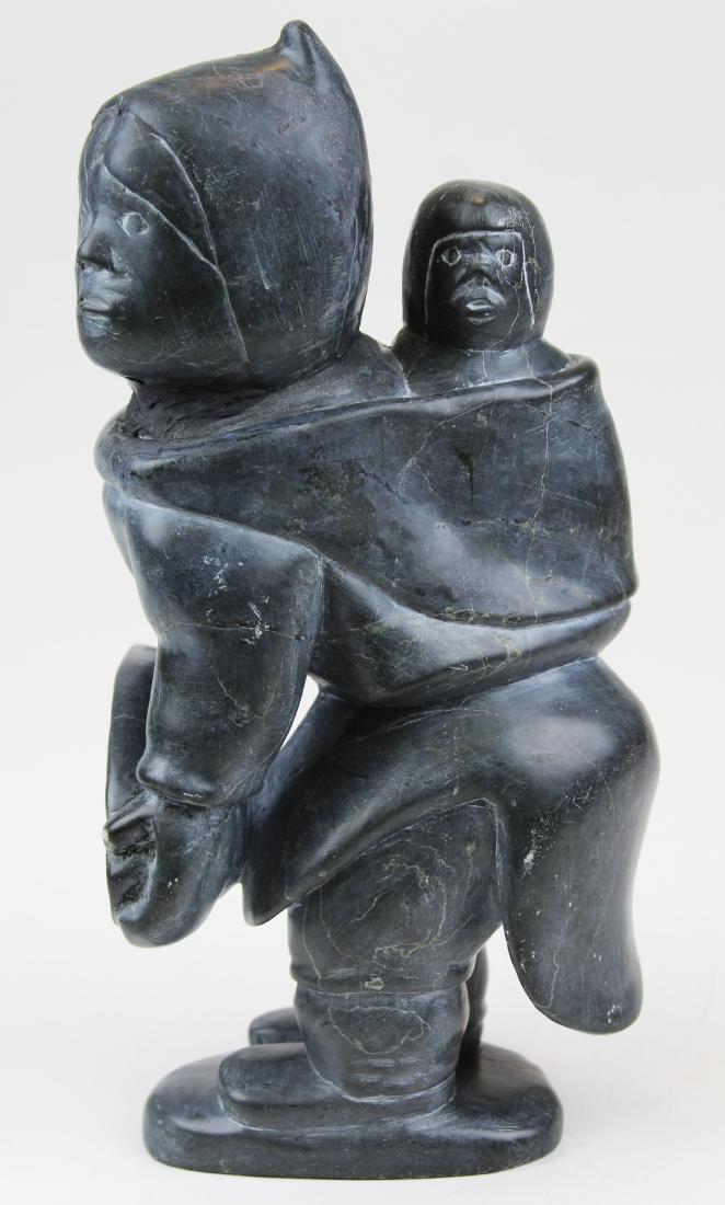 Inuit stone carving signed Lydia Qumak: Inuit stone carving of mother & child signed Lydia Qumak (repairs), ht 10 3/4"