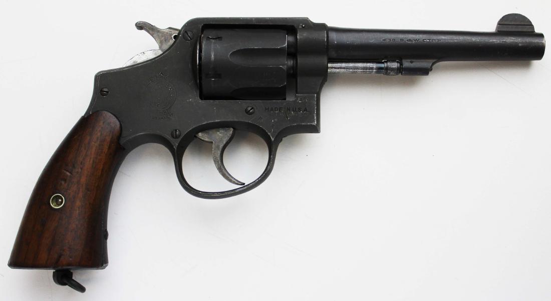 Smith and Wesson Model 10 US Military pistol: Parkerized Smith and Wesson Model 10 pistol in .38 Special with US Military stamps and markings including "United States Property" Serial number V49090 on bottom strap, 98246 on frame by cylinder - Th