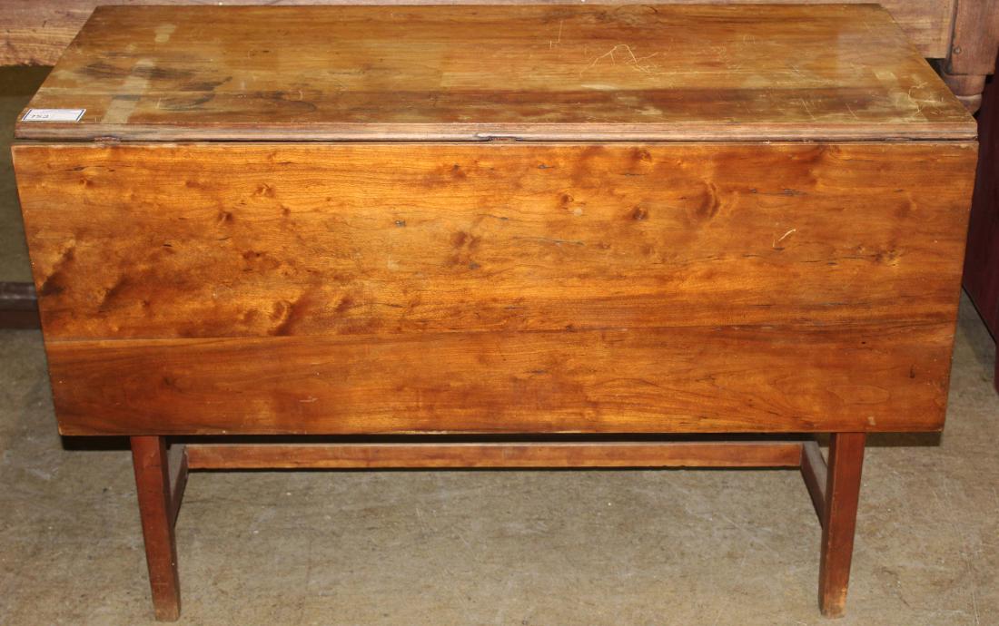 cherry drop leaf table with H-stretcher base: 19th c. Hepplewhite cherry drop leaf table with H-stretcher base, some staining to top 27.5" x 42.25" x 48"