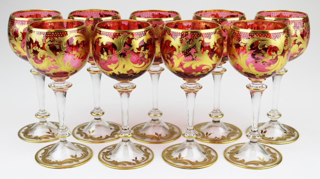 9 Moser gilt cranberry glass dessert wine goblets: set of 9 fine 19th c. attributed Moser cranberry glass dessert wine goblets with gilt enamel floral and rococo motif decoration on bowls and stems 5.75" x 2.5"