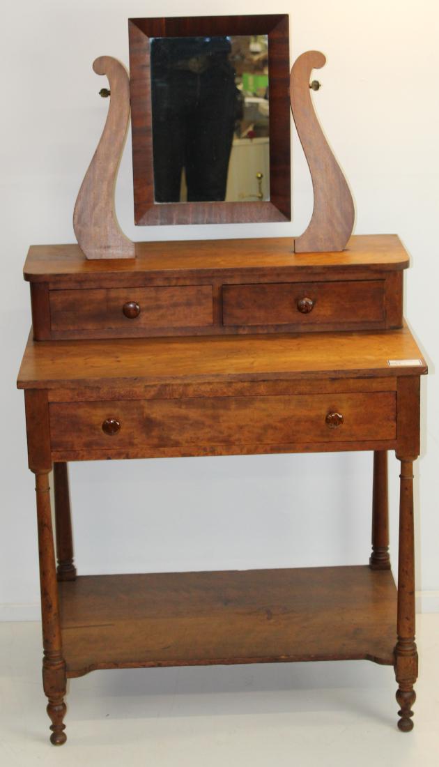 Sheraton cherry dressing table with mirror: 19th c. Sheraton cherry dressing table with mirror having 2 drawer deck top over long drawer, turned legs supporting lower shelf, retaining Bennington Pottery style knobs, nicely refinished 56" x 31" 
