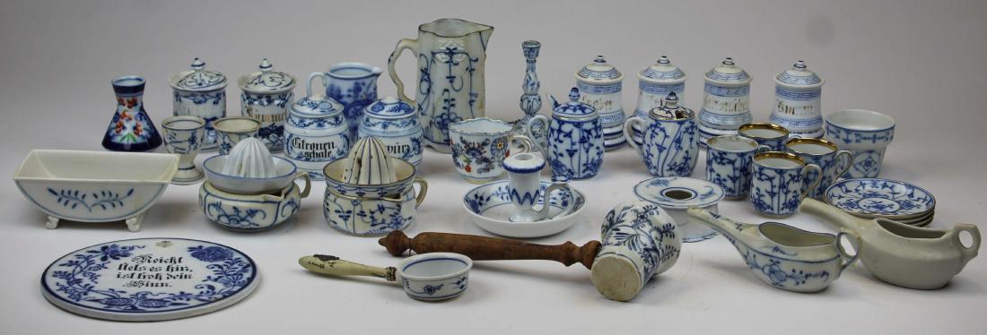 Meissen style Blue Onion porcelain accessories: collection of late 19th-early 20th c. Meissen style Blue Onion porcelain accessories including mustard pots, trivet, juice reamers, chamber candlestick, set of 4 demitasse cups, fine polychrome demita