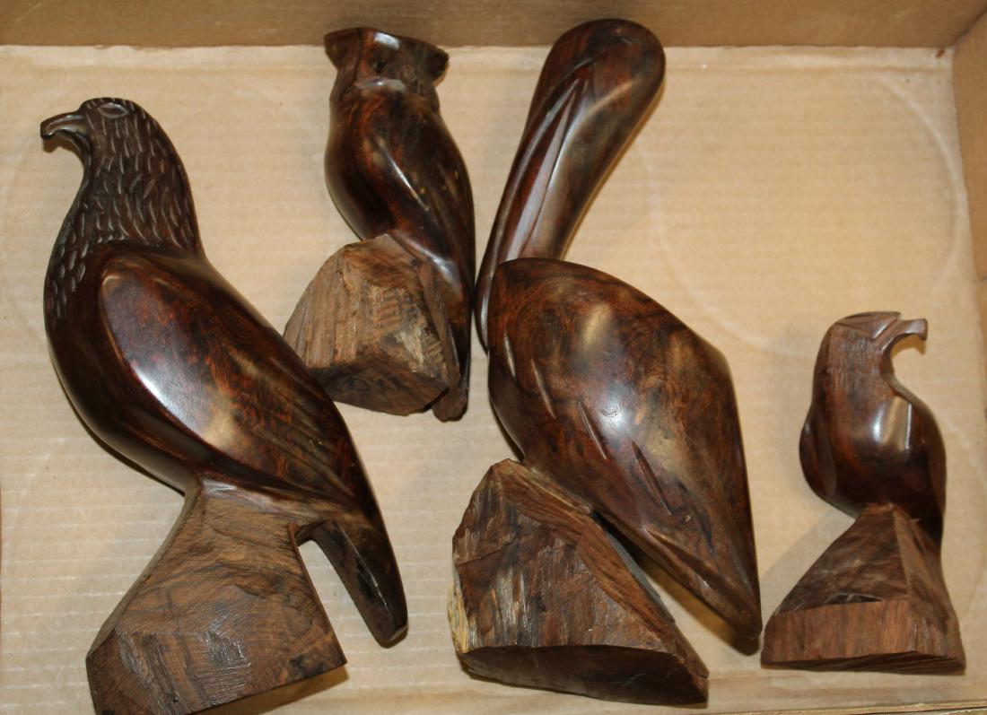 Four folk art carved birds: four folk art carved birds hand polished walnut. Owl, pelican raptor