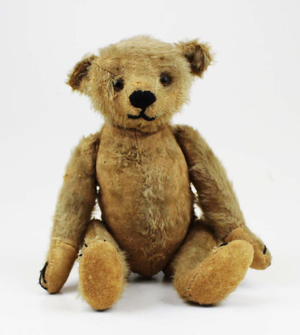 early Steiff jointed mohair teddy bear- no button: early Steiff jointed mohair teddy bear, no ear tag button, pointed nose, humped back, long bent arms, wear, old nanny repairs, replaced black yarn highlights, hand stitched felt paws replaced, overall