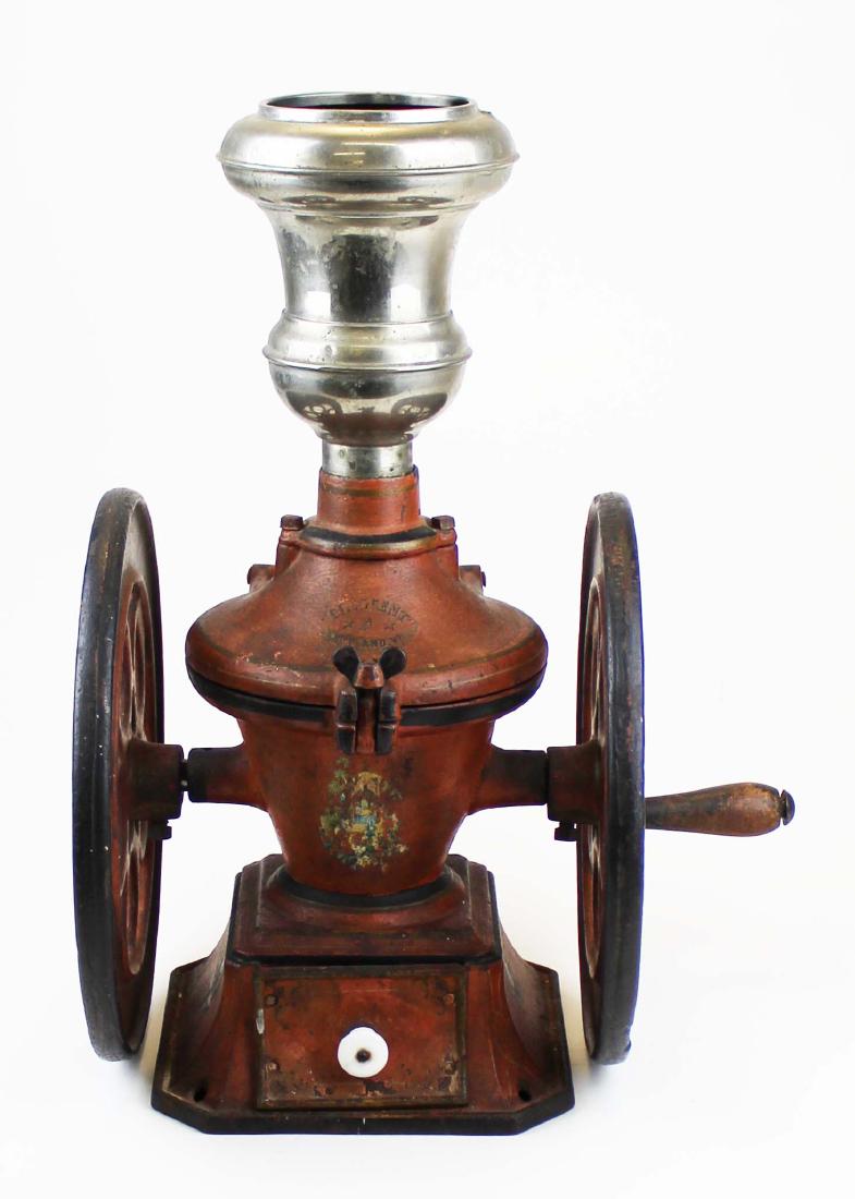 The Crescent Rutland Vermont Coffee Grinder: The Crescent Rutland Vermont cast iron coffee grinder in original paint missing cap wheels 12" diameter 21" high.