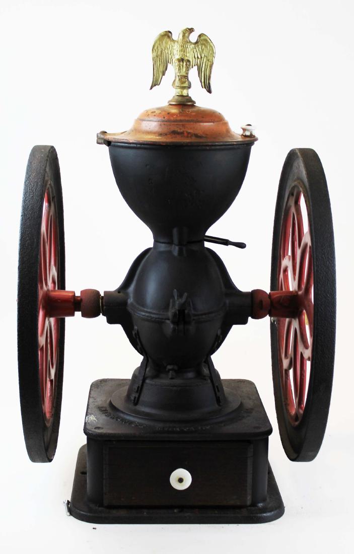 Enterprise Cast iron coffee grinder: Enterprise Philadelphia cast iron coffee grinder in later paint, break to upper body near lid. 18" wheel diameter approx 26" high