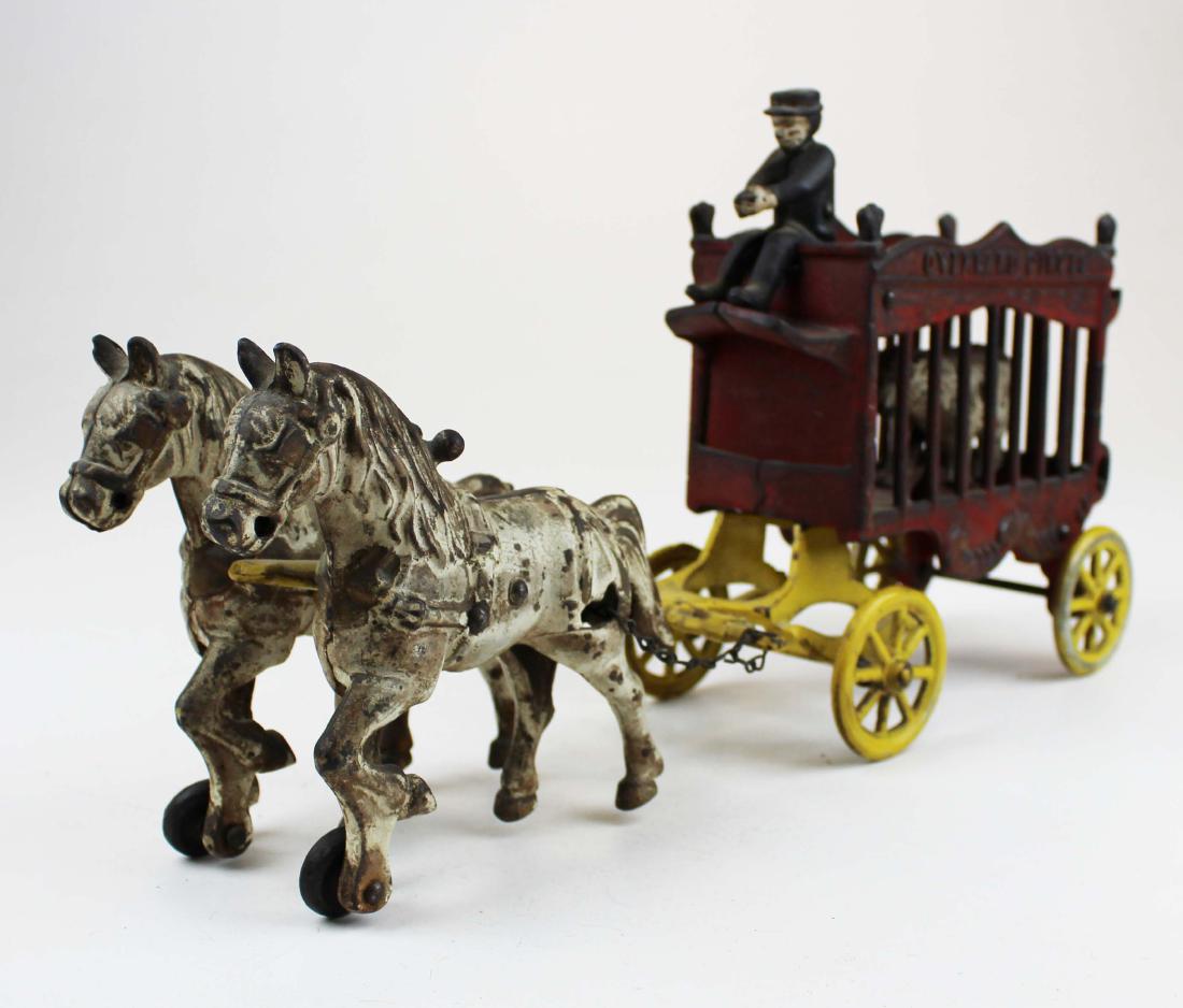Kenton Overland Circus cast iron wagon: Kenton Overland Circus cast iron wagon, with cast iron polar bear, overall length 14"