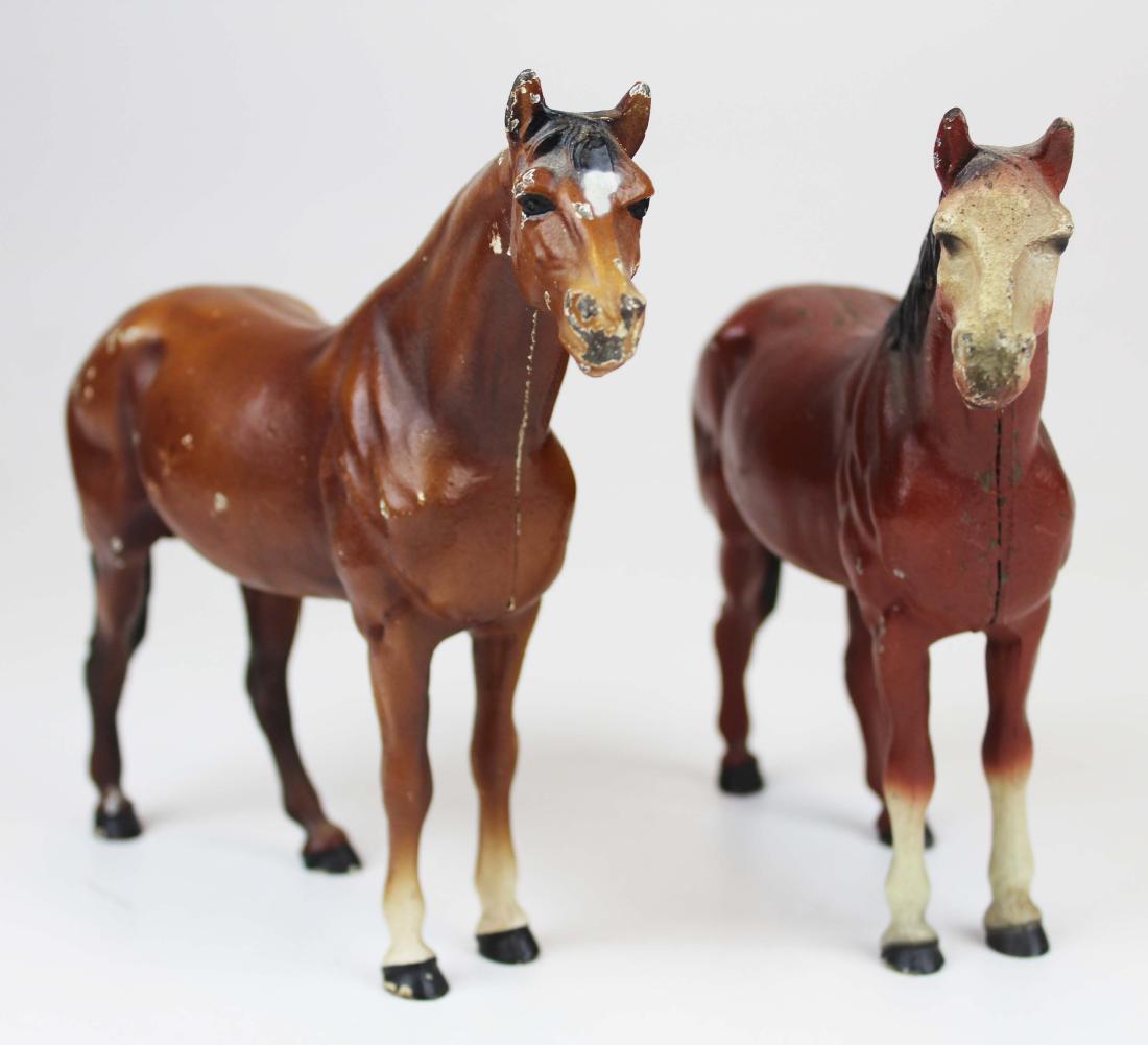 2 Hubley cast iron horse door stops: two Hubley cast iron horse doorstops, lengths 10 1/4"