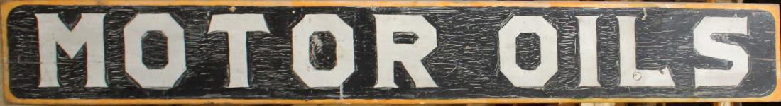 Early 20th c "Motor Oils " Advertising sign: Early 20th c wood and polychrome "Motor Oils" Petroliana trade/advertising sign minor aligatoring to top layer of paint. 9 x 68" reverse of sign has traces of "Auto Oils & Greases sign under white bas