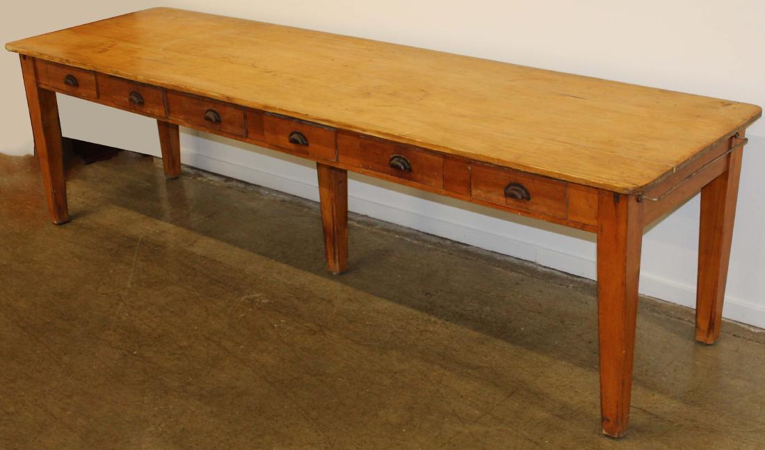 9 foot late 19th c country store table: Late 19th c pine country store work table having 6 long drawers and a 5th leg. 9 feet long 31" w x 30" h