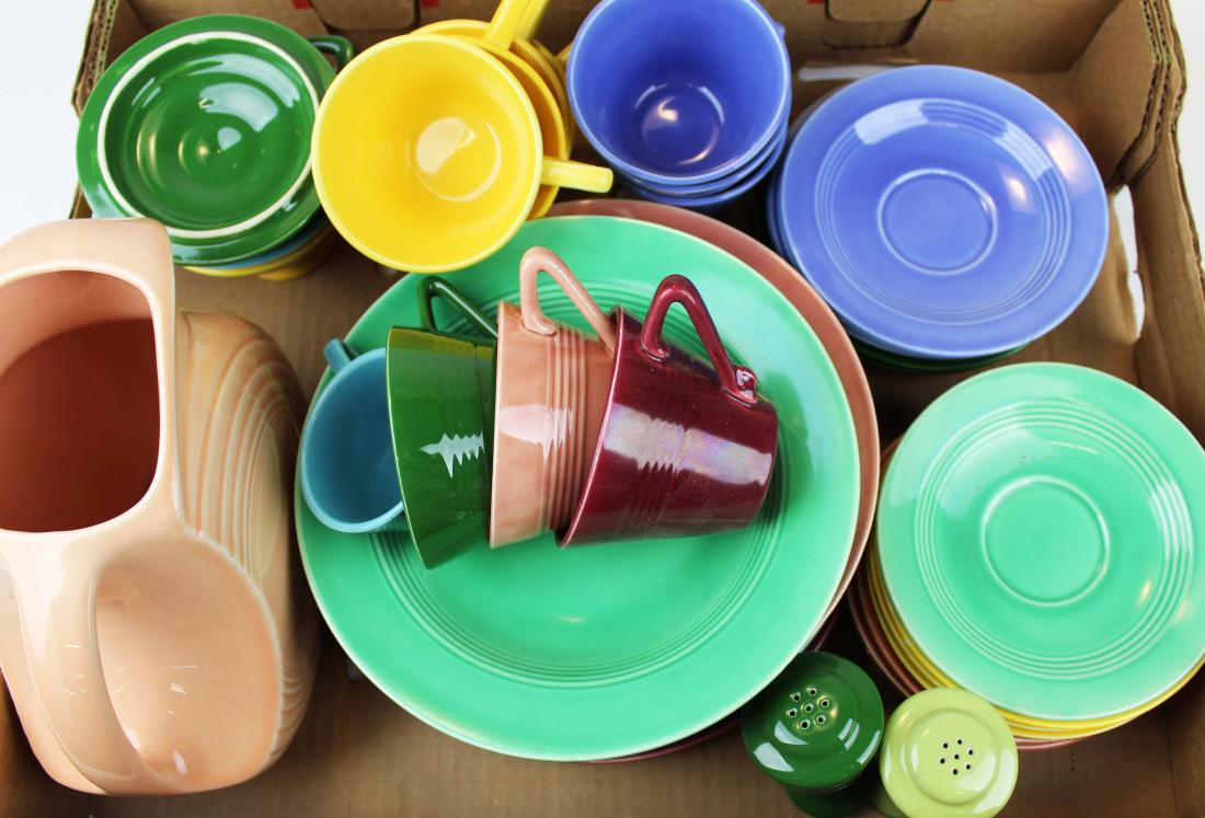 40 pcs. Homer Laughlin Harlequin dinnerware: approximately 40 pcs. Vintage Homer Laughlin Harlequin pattern Art Deco style colorful kitchen pottery dinnerware including cups, saucers, luncheon plates, serving bowl, sugar bowl, salt and pepper sh