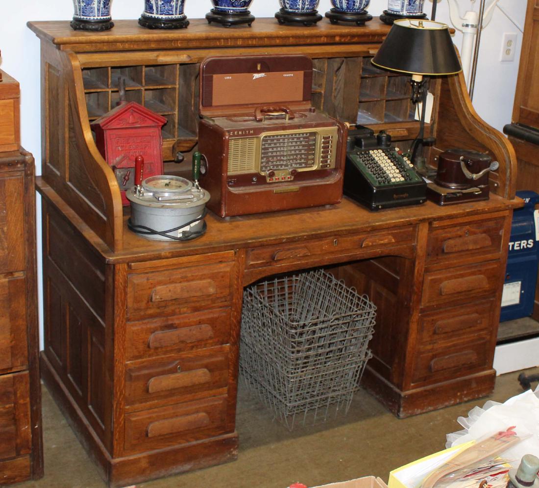 60" oak high bank roll top desk: Golden oak raise panel 60" high bank roll top desk. Overall good condition.