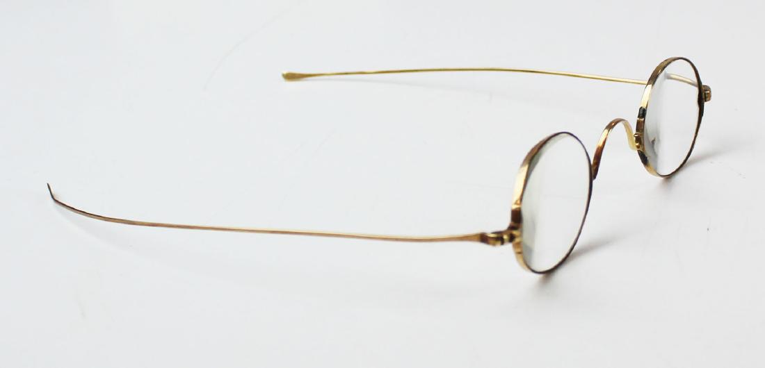 Pair of early 19th c 14k yellow gold eye glasses: Pair of 19th c 14k yellow gold eye glasses. About a 3 x lenses. Rose gold frames test 14k. Good condition. 12.3 grams total weight.