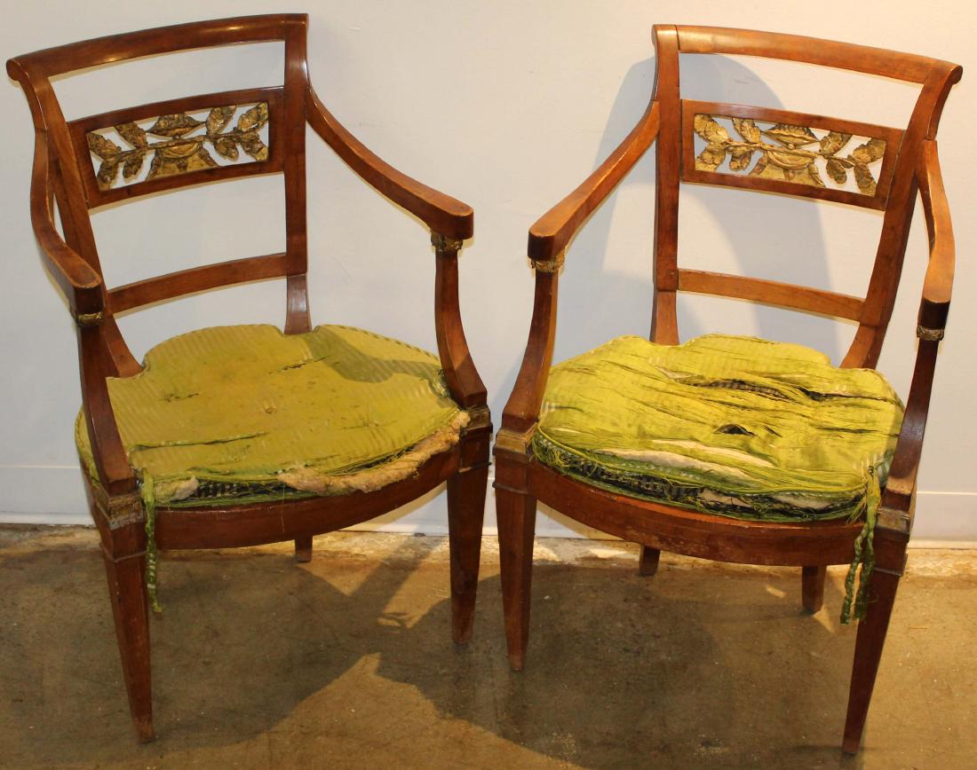 set of 6 Neoclassical carved & gilt armchairs: set of six Continental Neoclassical carved & gilt fruitwood armchairs, caned seats, some old repairs, ht 35", seat ht without shaped cushions 15"
