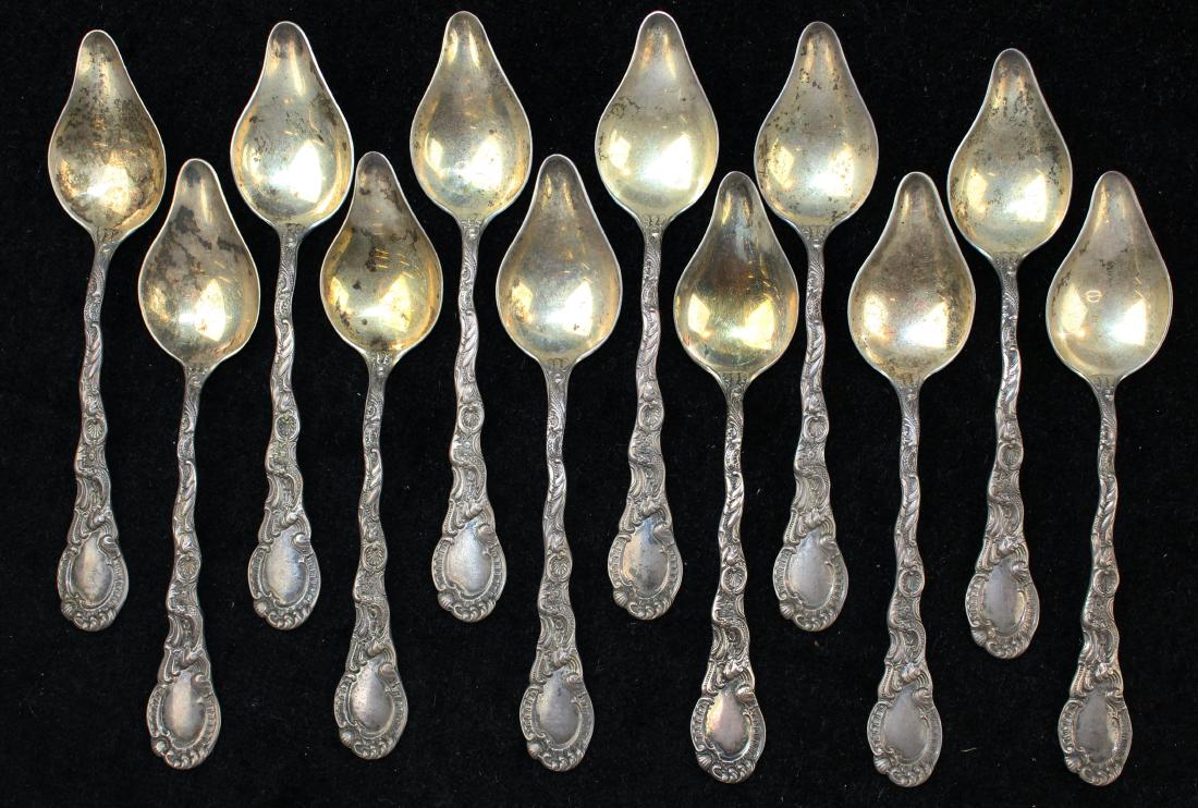 12 Durgin Louis XV sterling silver citrus spoons: set of 12 Durgin "Louis XV" pattern 1891 sterling silver citrus spoons with ornate rococo motif handles 5.5" 9.3 troy oz.
