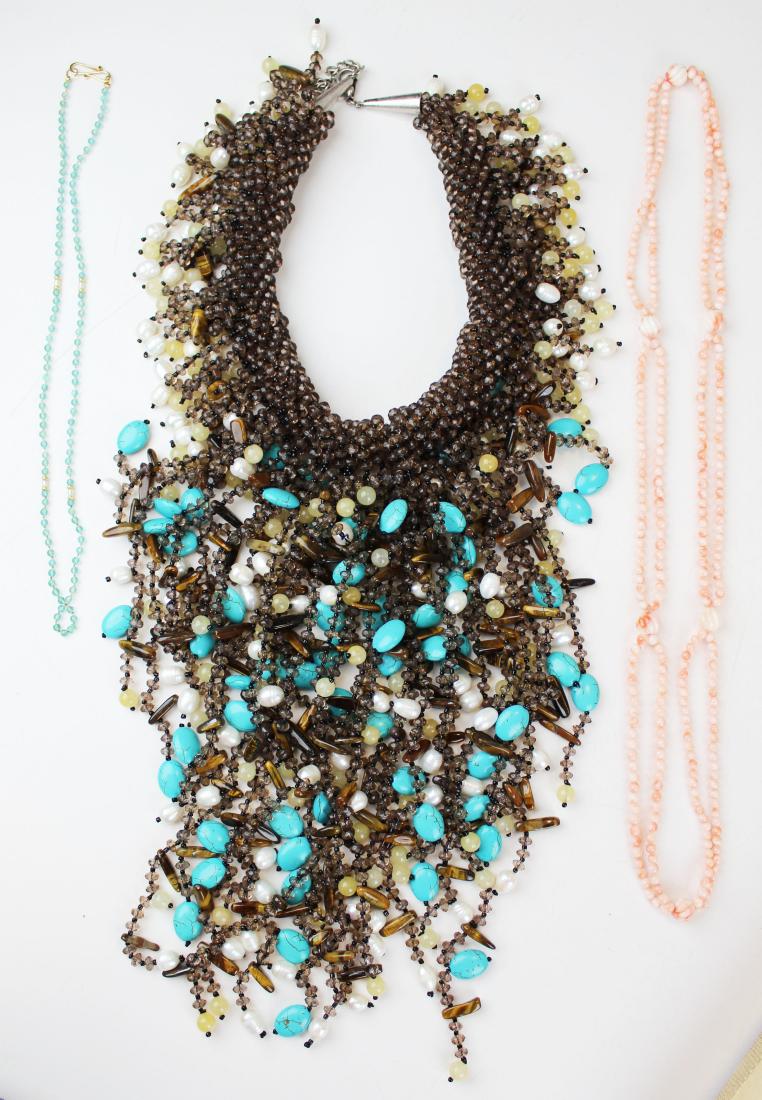 A group of 3 vintage necklaces: A group of 3 vintage necklaces including a delicate pink coral bead, a massive mother of pearl, turquoise and bead collar choker, and a fine fresh water pearl and possible green garnet polished bead n