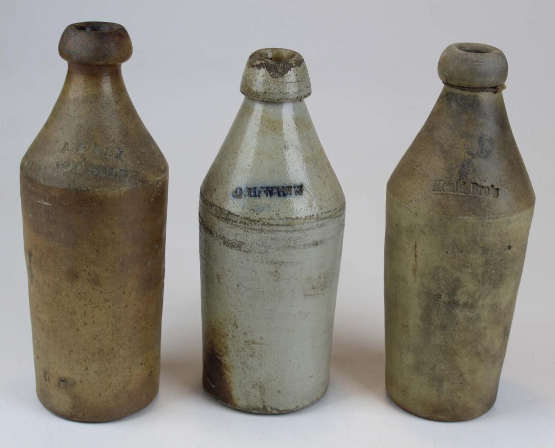 3 Stoneware Ginger Beer Bottles: Three stoneware bottles including Heald Bro's, A.P.Fly, one bottle contains a chip at mouth. All Ht 10-10.5"