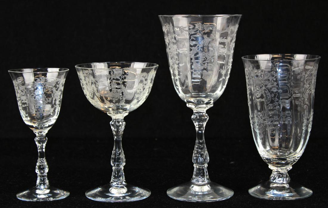 24 pcs. Fostoria Navarre pattern stemware: 24 pcs. Fostoria Navarre pattern stemware including 8 wine goblets, 3 footed water glasses, 7 sherry glasses, 6 champagne glasses