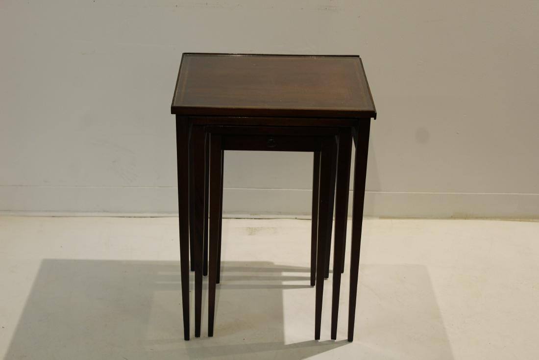 Hekman String Inlaid Glass Topped Nesting Tables: Glass topped nesting table with string inlaid top, single drawer on smallest table, marked "Hekman Tables of Merit, Grand Rapids Michigan" 14"w 18"d 26"h