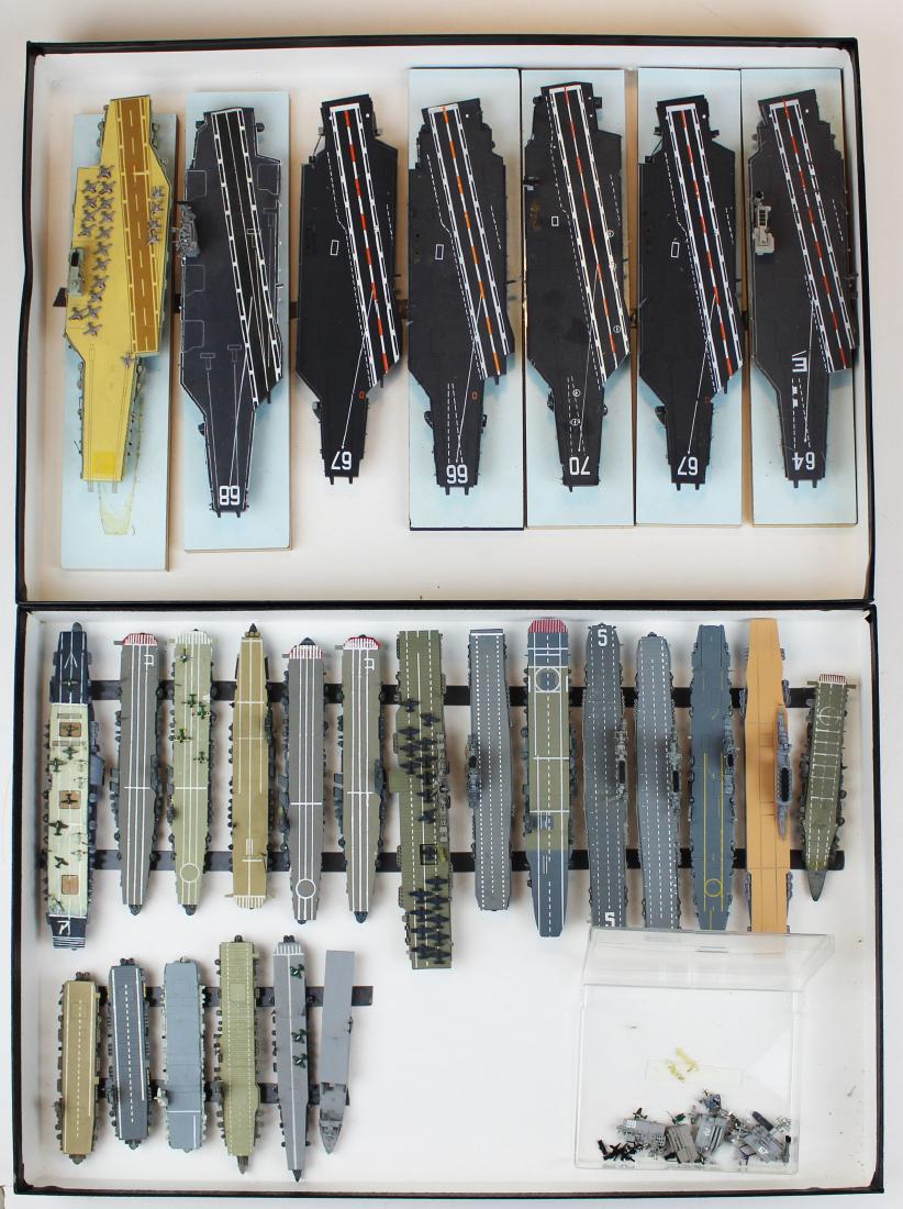 collection of 1/ 1250 scale aircraft carriers: collection of 27 1/ 1250 scale aircraft carriers, presented in two display cases, lengths from 4 3/4" to 10"