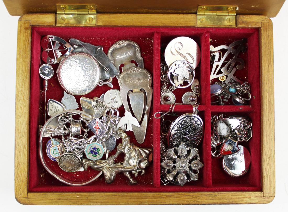 lot of sterling silver jewelry and accessories: lot of sterling silver jewelry and accessories including charm bracelets, pins, lockets, pendants bookmarks, etc.