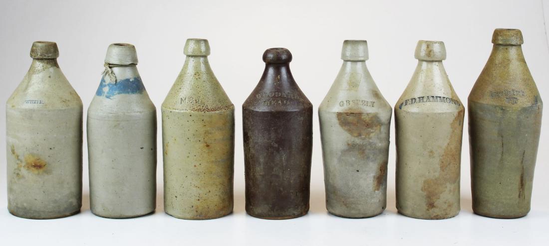 seven stoneware ginger beer & mead bottles: seven stoneware ginger beer & mead bottles, including Woodard's Mead, White, F D Hammond, Ingall's Bros Pop (Portland, ME), hts 10" to 11"