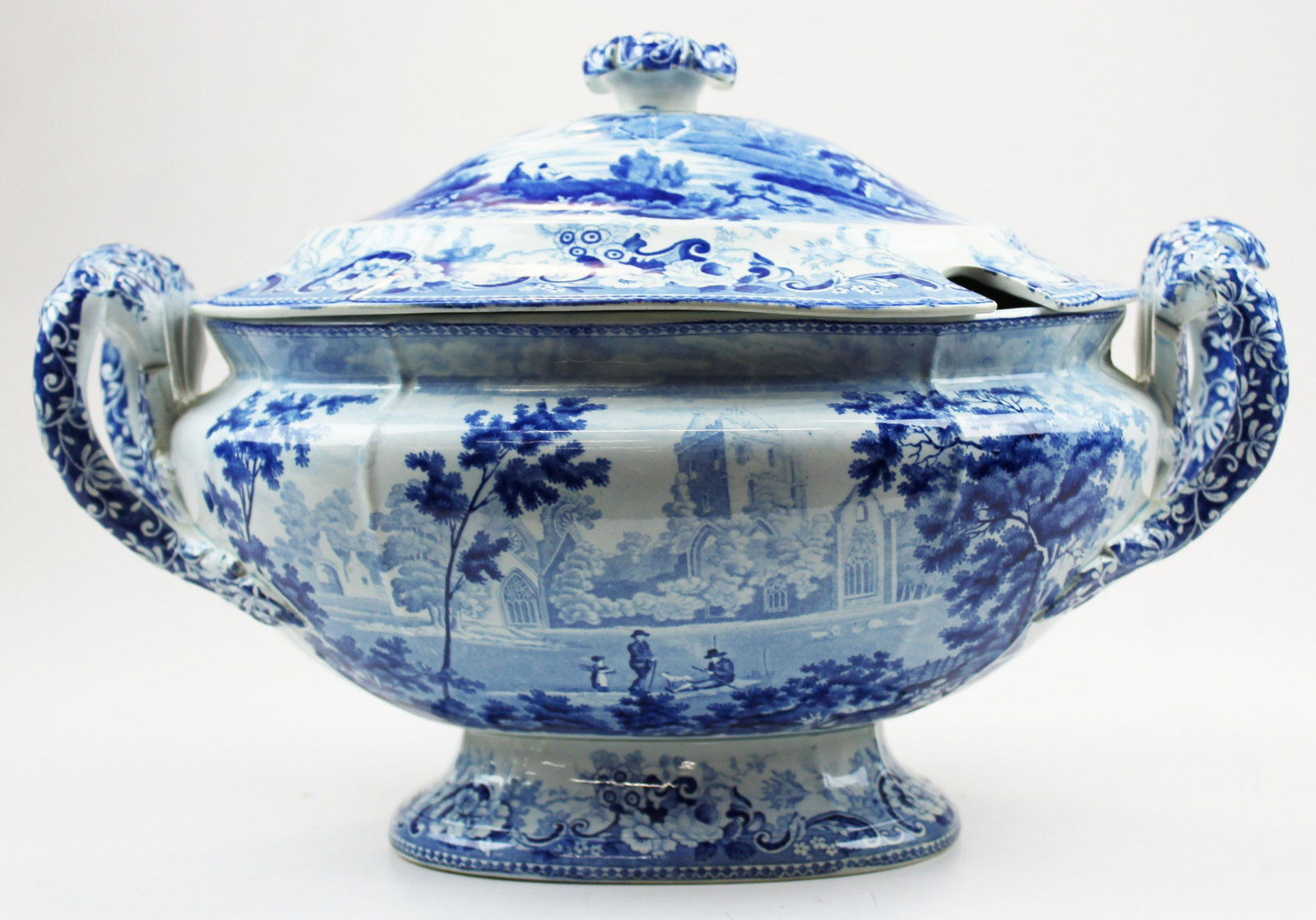 Romantic blue Staffordshire covered tureen: Romantic blue Staffordshire covered tureen, few nicks under rim of lid, ht 10 1/2", length 14 3/4"