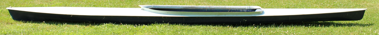 Martin Marine Co. rowing shell and sculling oars: This lot includes an OarMaster portable recreational rowing assembly including track, sliding seat, adjustable stretcher (footrest, riggers, oarlocks) which has been mounted on a wooden frame for use