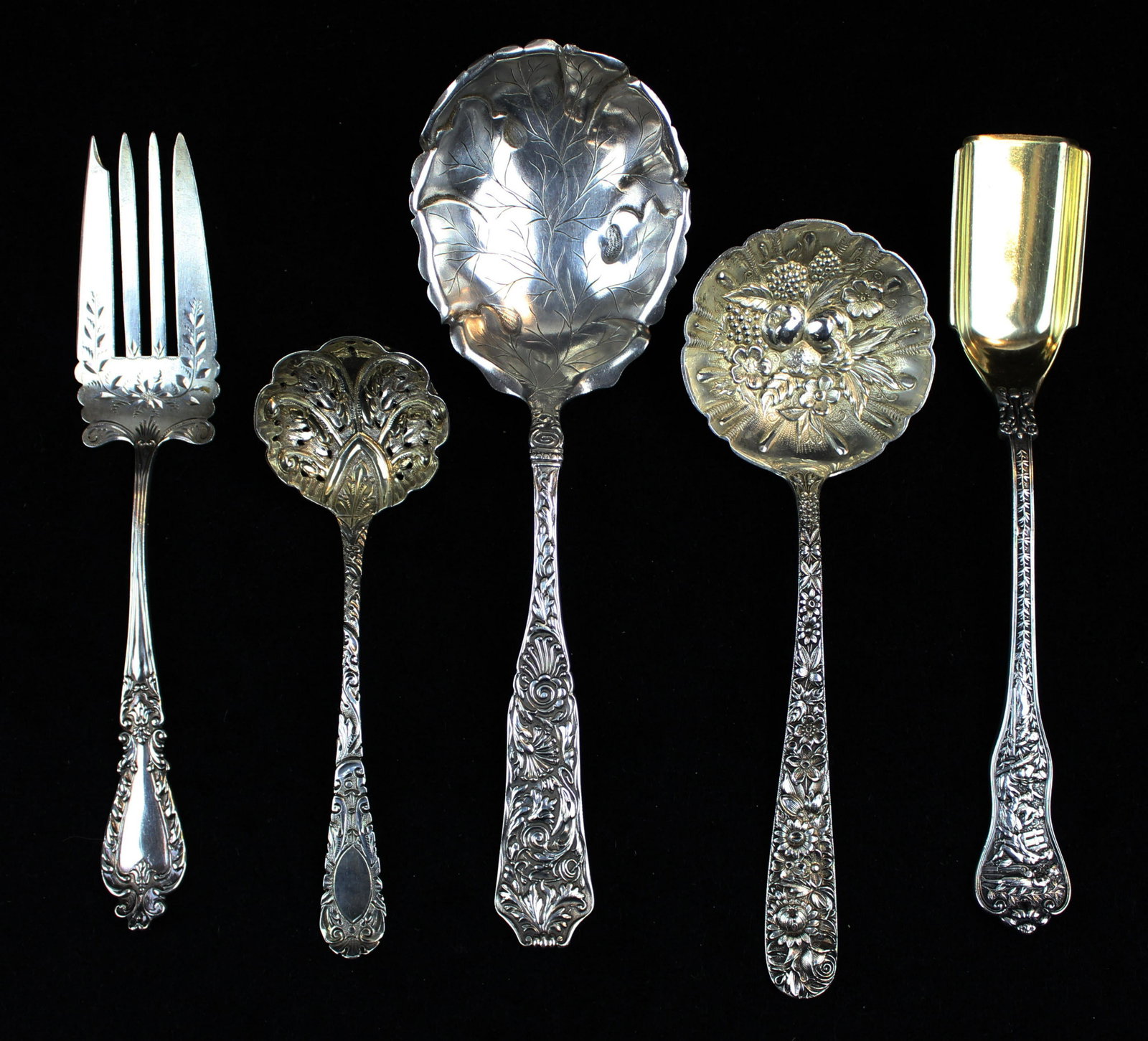 5 pcs. sterling serving flatware including Tiffany: 5 pcs. Ornate sterling serving flatware including Tiffany & Co. "Olympian" pattern soft cheese scoop with gold wash vermeil bowl (handle skillfully repaired), Kirk "Repousse" pattern berry spoon, J. B