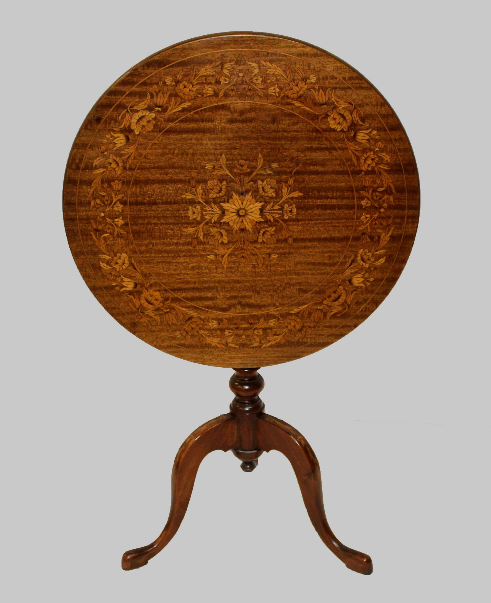 19th c. marquetry inlaid tilt top tea table: fine late 19th c. marquetry inlaid tilt top tea table with outstanding floral decoration on top and legs dia. 24.5" 28" ht.