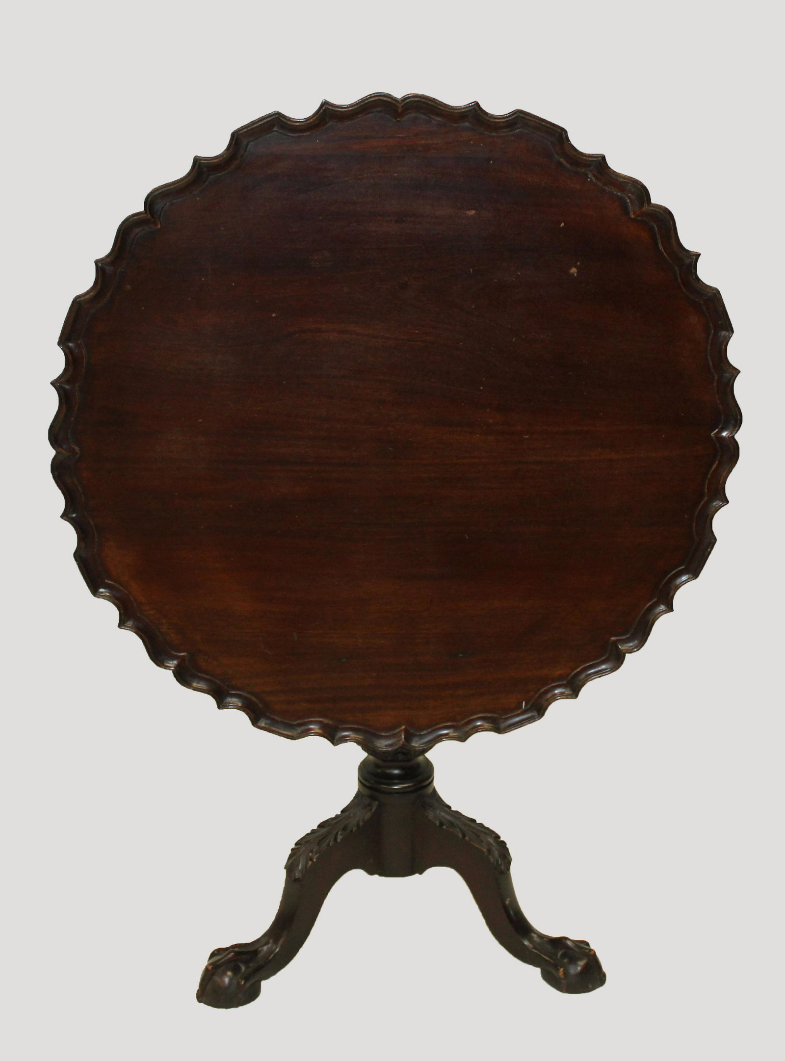 Chippendale mahogany pie crust tea table: fine early 20th c. bench made Chippendale style mahogany pie crust edge tea table on ball and claw foot base 34" d. 20" ht.