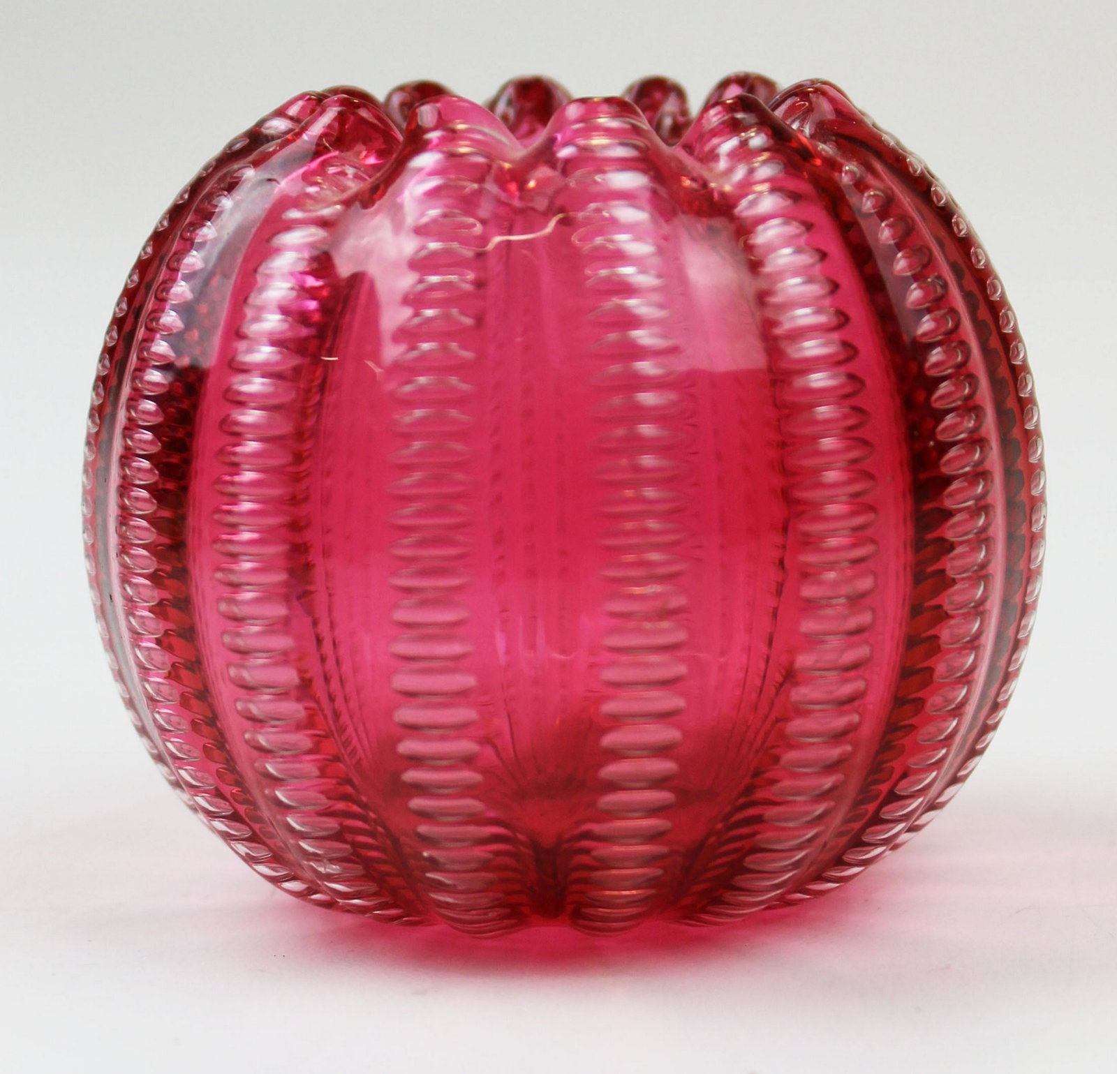 Jewel glass cranberry bowl by Stevens & Williams: Jewel glass cranberry bowl designed by Frederick Carder for Stevens & Williams, controlled zipper airtrap pattern, ruffled rim, marked "Rd. 55693", ht 2 1/4"