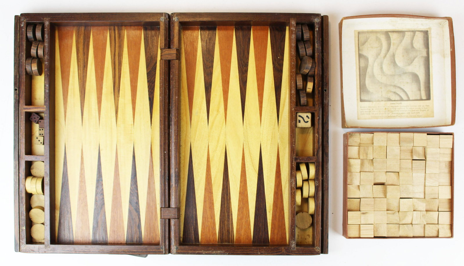mid 20th c inlaid backgammon board: mid 20th c inlaid backgammon board with exotic woods, sold with a Contoura wooden puzzle block game, backgammon folding board open 21 1/2" x 16 1/2"