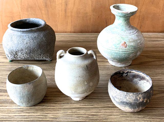 A group of 5 Han Dynasty vessels.: A group of 5 Chinese Han Dynasty vessels including green glaze bulbous vase, small double handle mat glaze vase, and 3 bowls with intaglio pressed design. 7" to 3" high. Worn