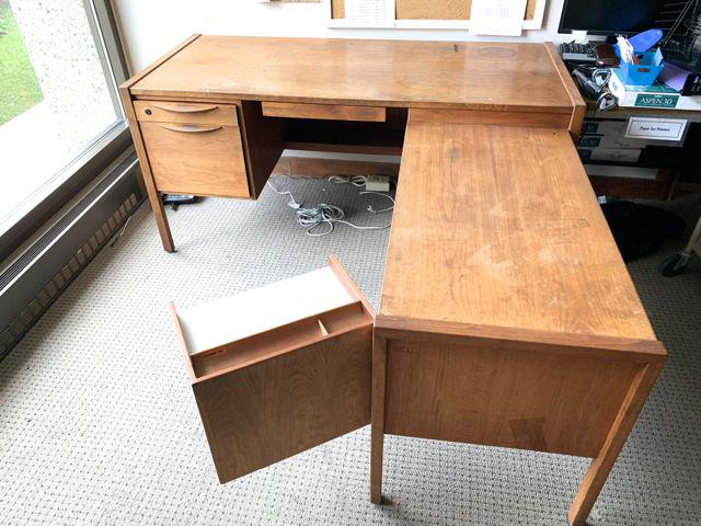 Jens Risom design executive desk: Jens Risom design mid century Danish modern L shaped executive desk. L form desk 32" x 27" connected to a 39" x 21" L section. Fold out file compartment. Lower shelves. File and supply drawer.