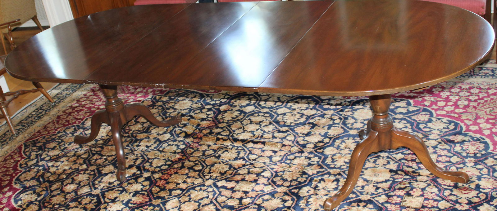 Kittinger mahogany dining table and 10 chairs: Kittinger Queen Anne style snake leg mahogany double pedestal base dining table with two leaves 104" x 44" x 29" fully extended