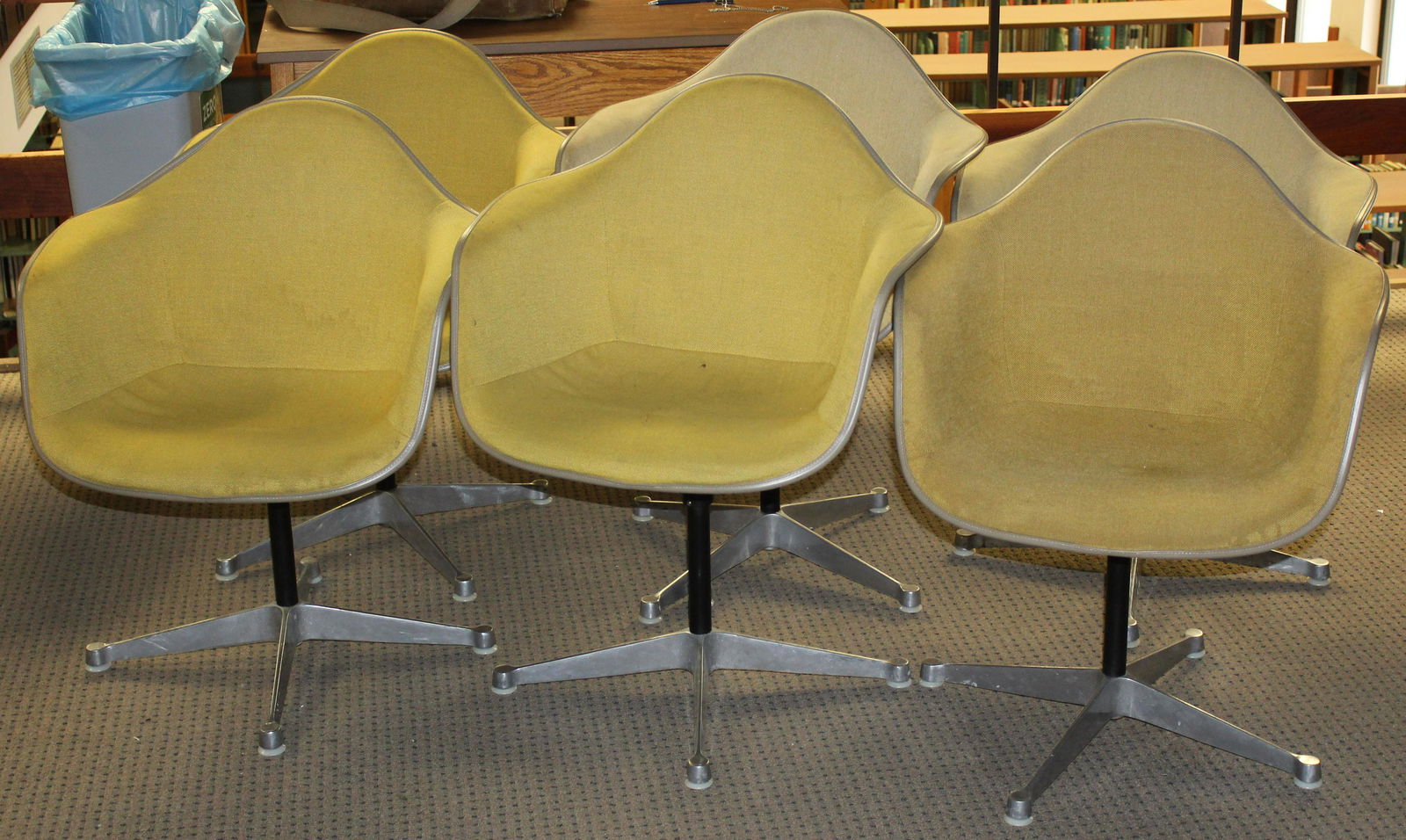 Set of 6 Gold Herman Miller Shell Chairs: Charles and Ray Eames designed "La Fonda" Herman Miller mid century industrial shell chairs in Gold Upholstery with Feb 11 1970 delivery stickers on most