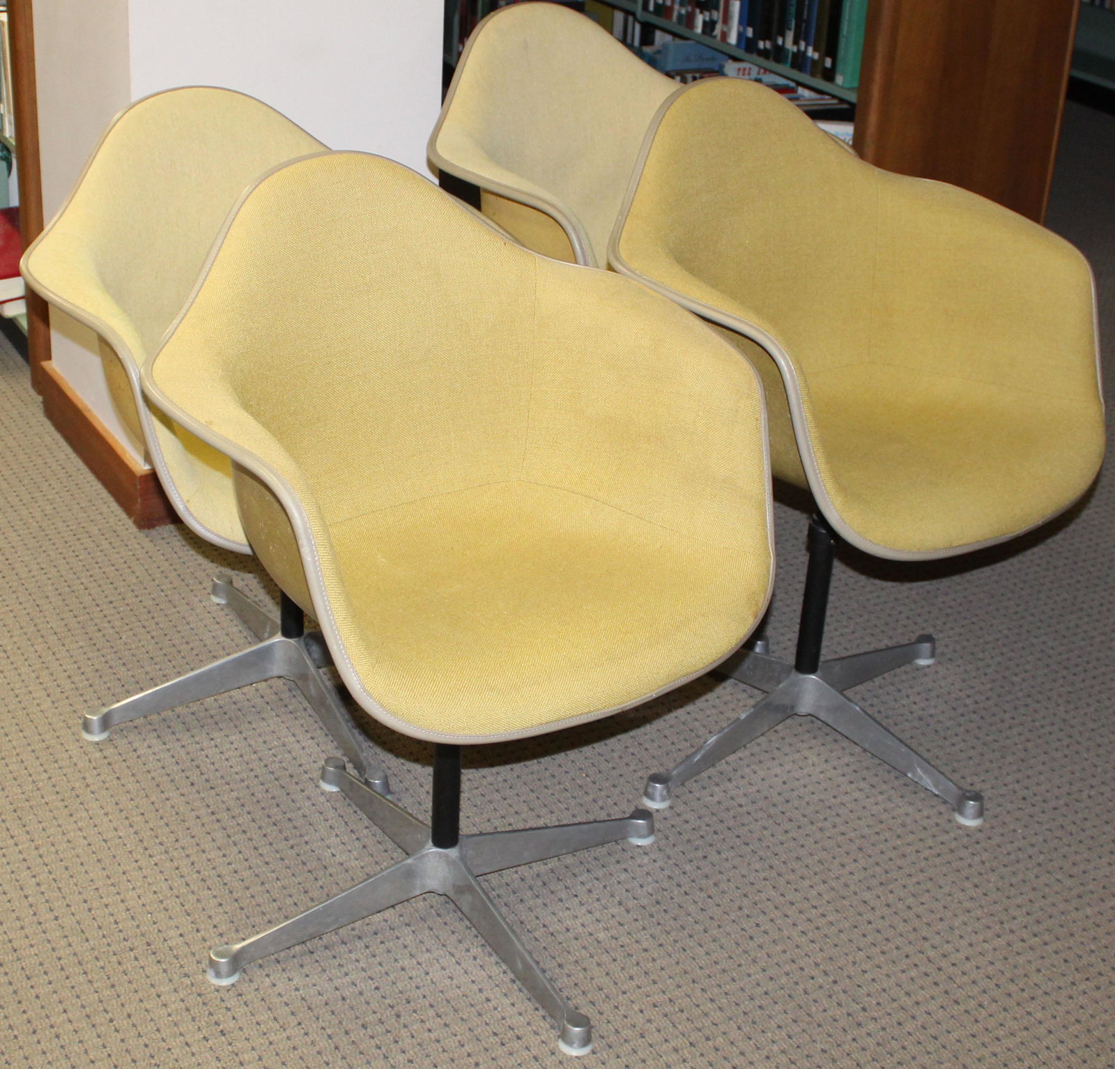 Four Gold Herman Miller Shell Chairs: Charles and Ray Eames designed Herman Miller "La Fonda" mid-century industrial shell chairs dated Feb 1970 most marked with GMC LIB underneath