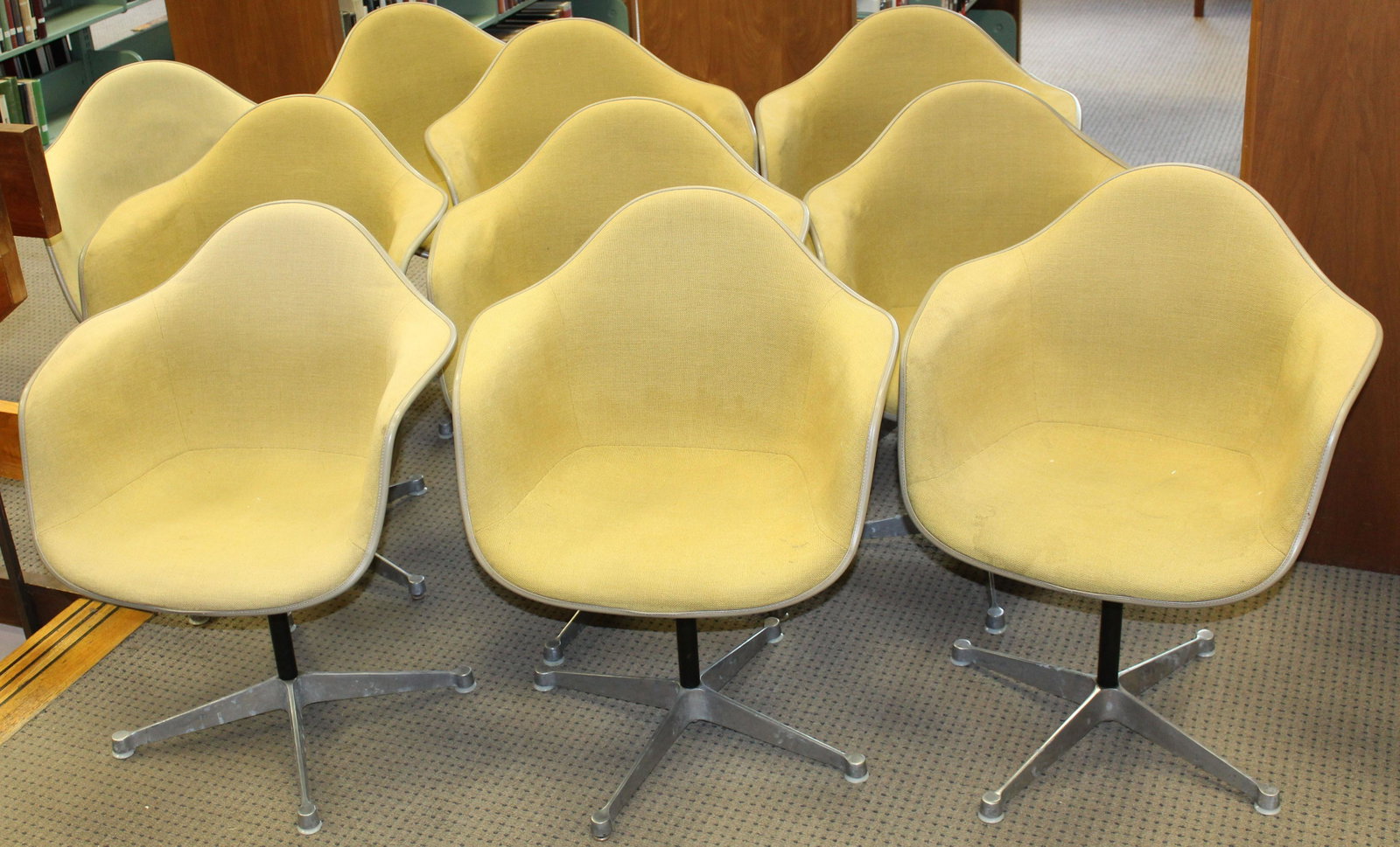 Ten Tan Herman Miller Chairs: Ten Charles and Ray Eames designed Herman Miller "La Fonda" mid- century industrial shell chairs in Tan upholstery most marked FEB 1970 some with GMC LIB etched on underside of shell