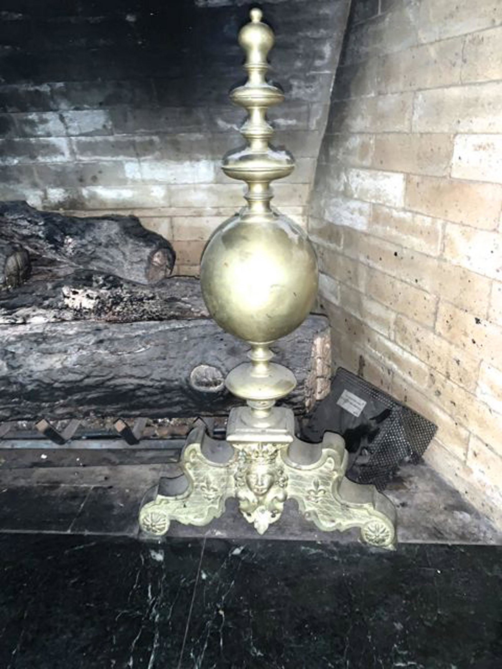 Pair of brass Victorian andirons: A pair of brass Victorian andirons with Jenny Lynn busts. 28" h. (Note: Does not include fire box)