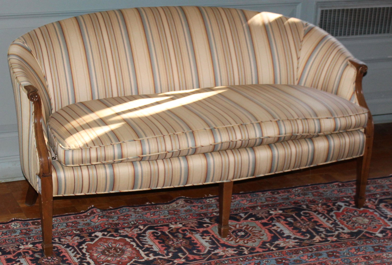 Sheraton mahogany spade foot settee: fine custom 20th c. Sheraton style mahogany spade foot settee or loveseat in striped upholstery 31" x 62" x 31"