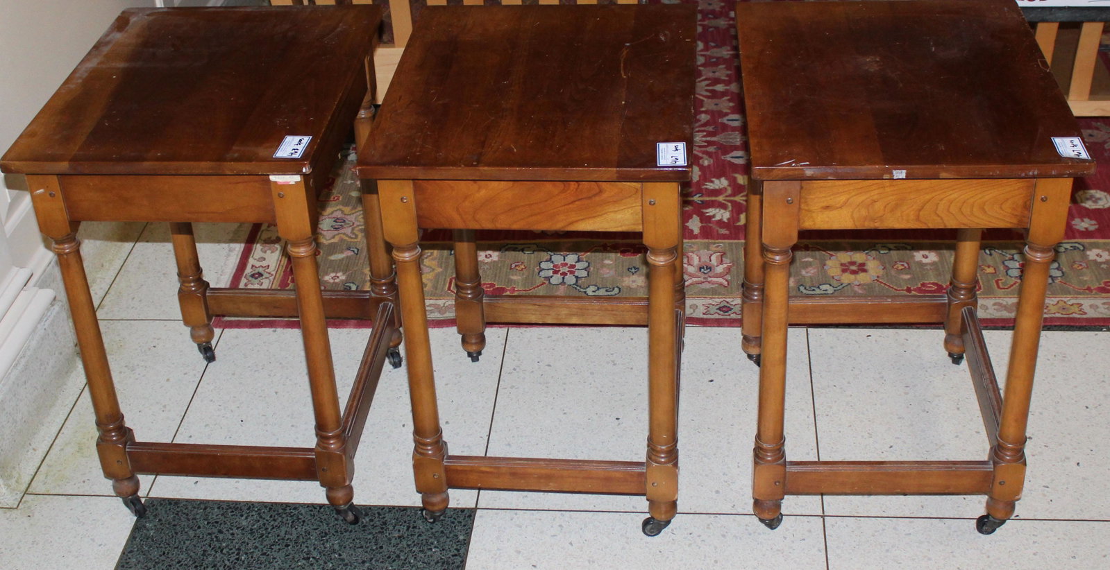 set of Leopold Stickley Cherry Valley end tables: set of 3 of L. & J.G. Stickley Leopold Stickley Cherry Valley mid 20th c. William and Mary style end tables with turned legs and stretcher bases, on castor wheels 28" x 22" x 18"