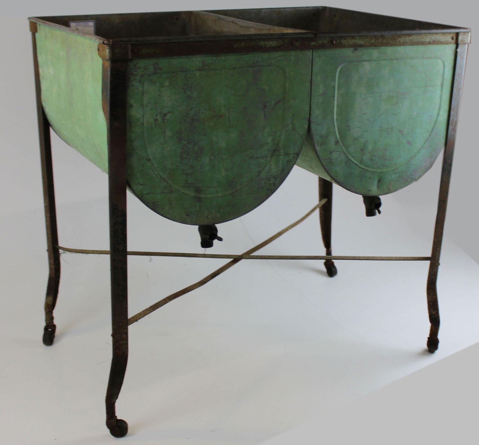 early 20th c double wash sink in old paint: vintage early 20th c double wash sink in old apple green paint, from a sugar house in Fayston, VT, used for rinsing sap buckets, oxidation on wheels, 33 1/2" x 22 1/2" x 34" ht