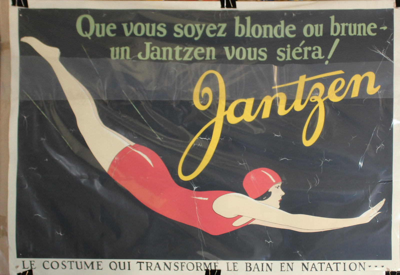 Circa 1930 Jantzen Swimwear poster: Circa 1930 Jantzen swimwear poster with famed diving girl motif 35 x 50" numerous creases, minor losses and pinholes at corners.