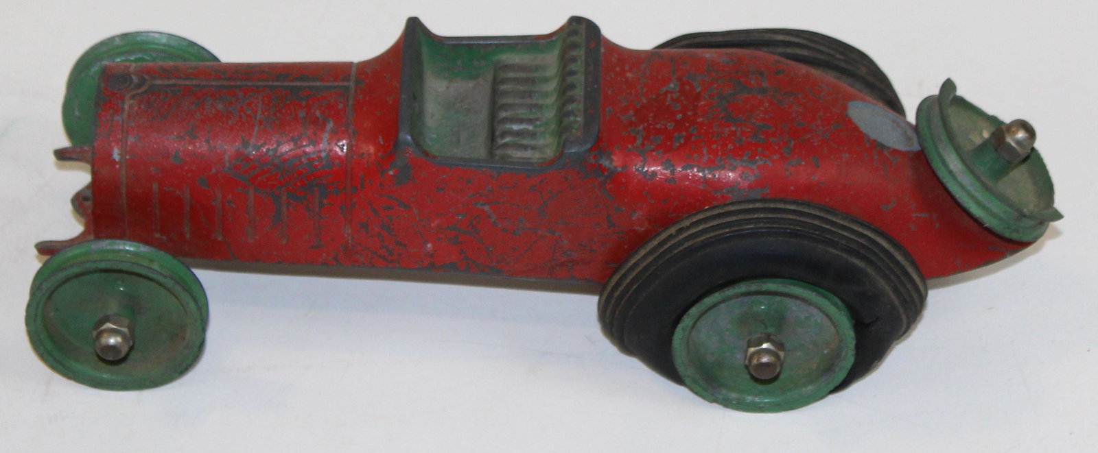 rare Faith Mfg Co cast aluminum race car: rare Faith Manufacturing Company cast aluminum race car, tires melted, spare tire rim chipped, length 11"