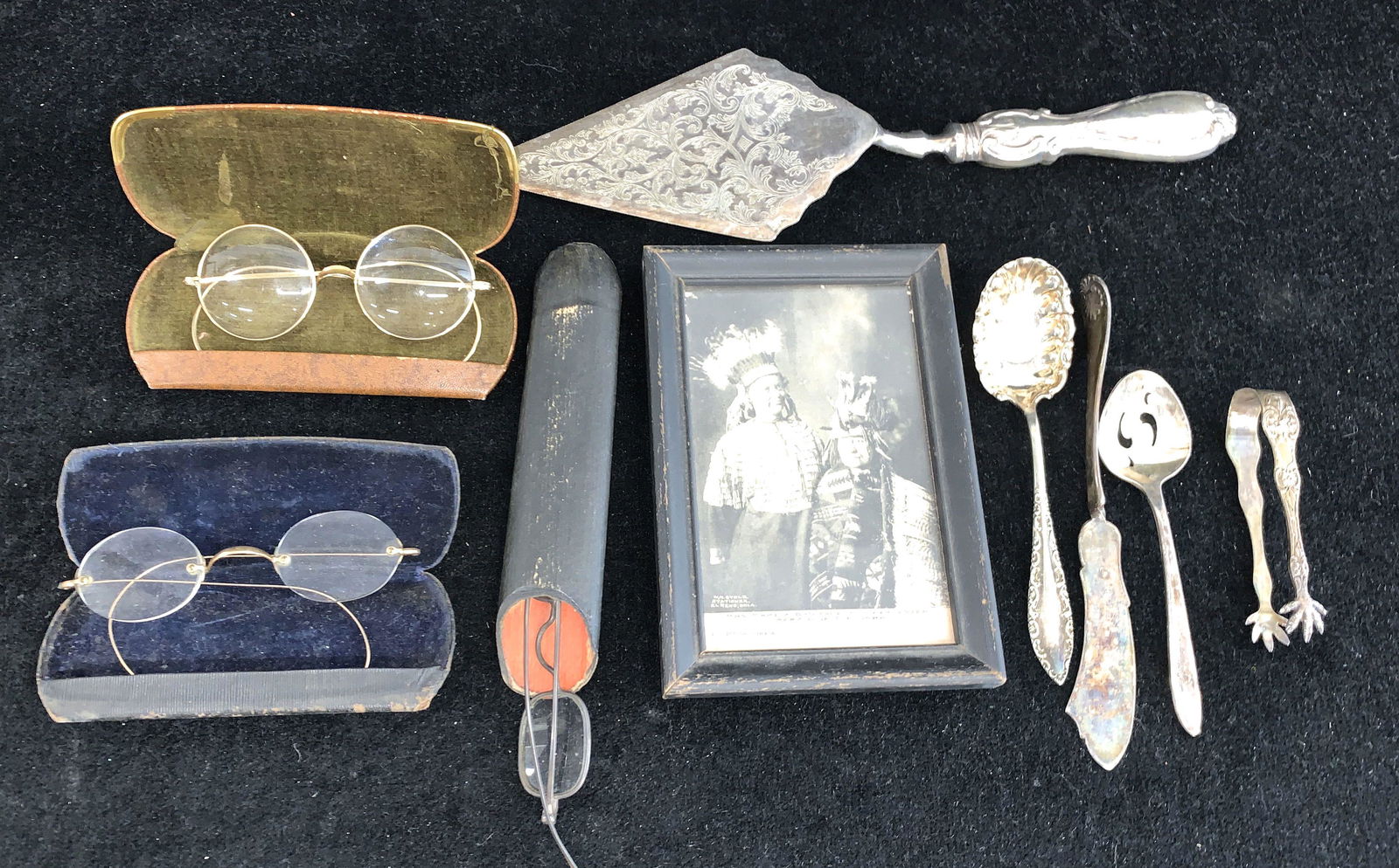 Early eye glasses: A mixed lot with 3 pair of 19th c eye glasses in cases, silver plated flatware and a post card from El Reno Okla. Of Mrs. Make a bad face and her sister afraid of the dark.